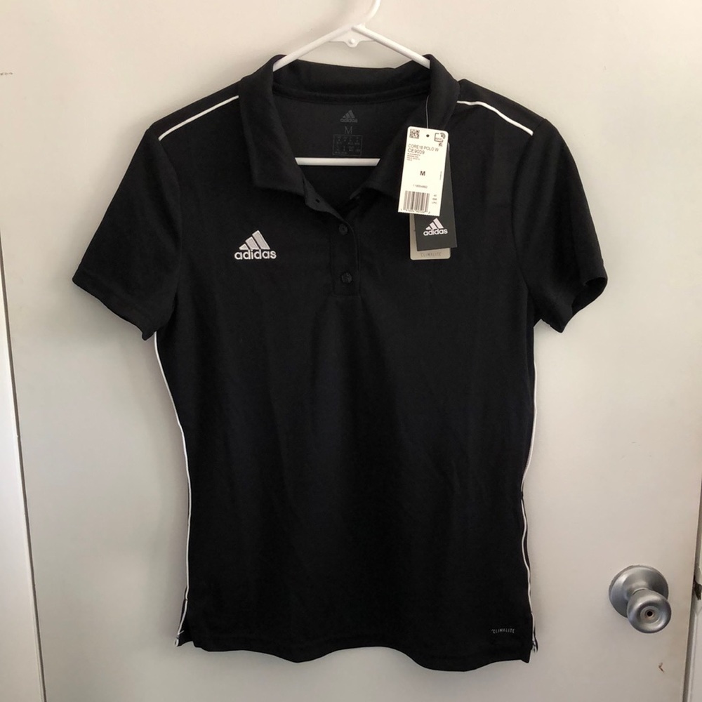Black Adidas golf shirt.